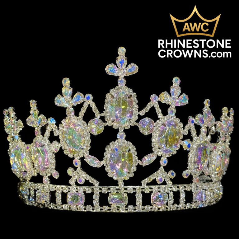 The Kimmy Series - 4.5"x6.5" Crown features sparkling quince style with large oval and round gems, intricate patterns, and iridescent stones. AWC and RHINESTONECROWNS.com logos appear in the top right corner.