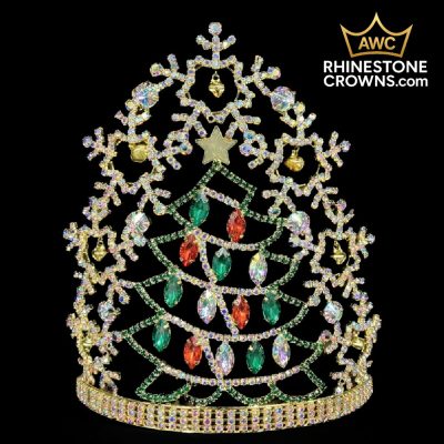 The Jingle All The Way Series-8" Crown is a festive Christmas tree-shaped rhinestone crown with green and red gems, a gold star topper, and snowflake accents—ideal for dance or pageants. AWC RhinestoneCrowns.com logo appears in the top right corner.