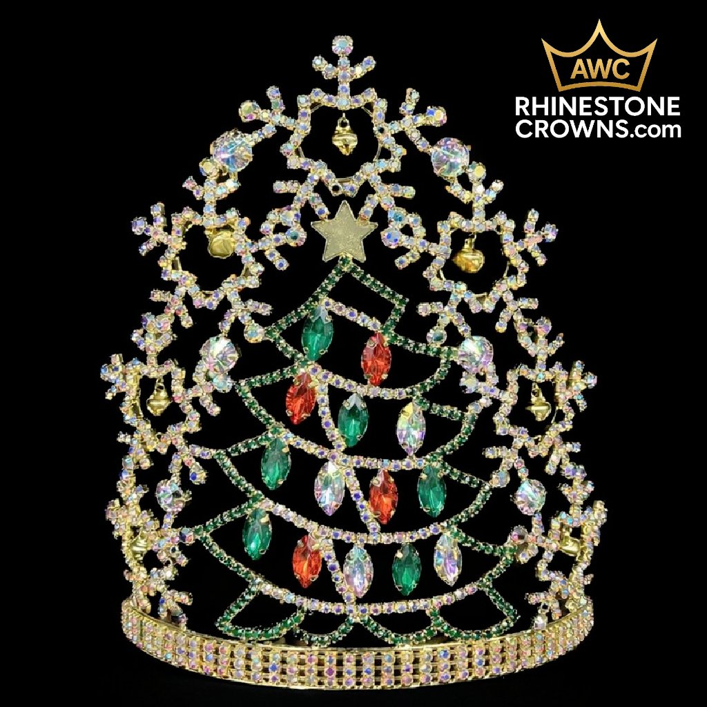The Jingle All The Way Series-8" Crown is a festive Christmas tree-shaped rhinestone crown with green and red gems, a gold star topper, and snowflake accents—ideal for dance or pageants. AWC RhinestoneCrowns.com logo appears in the top right corner.