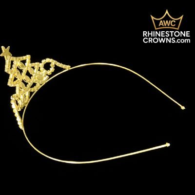 The Jingle All The Way Series-Economy 2" Tiara is shown on a black background, ideal for pageants or brides. The AWC RhinestoneCrowns.com logo with a gold crown graphic appears in the top right corner.
