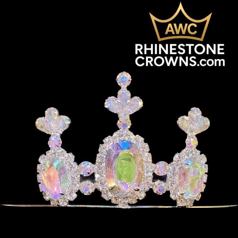 The Kimmy Series - Economy 2" Tiara features sparkling rhinestones and three large iridescent oval gems, accented by smaller crystals. Set against a black background with the AWC RhinestoneCrowns.com logo in the top right corner.