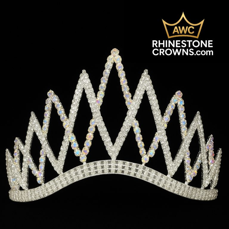 The Clear Melissa Series - 4" Wide Span crown, featuring a zigzag rhinestone design, is shown on a black background. Ideal for pageants, the AWC RhinestoneCrowns.com logo appears in white and gold at the top right corner.