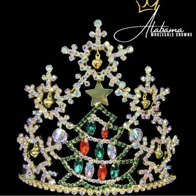The Jingle All The Way Series-5" Crown features a Christmas tree shape with red, green, and clear gems, gold accents, and a gold star on top—ideal as a quince crown or festive pageant piece. “Alabama Wholesale Crowns” logo appears in the upper right corner.